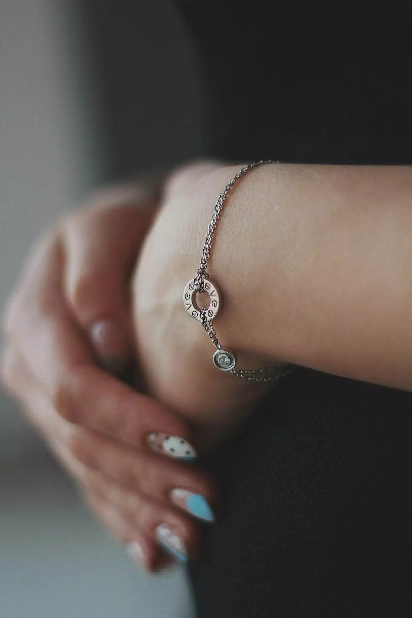 Vertical shot of a young female wearing a beautiful silver bracelet